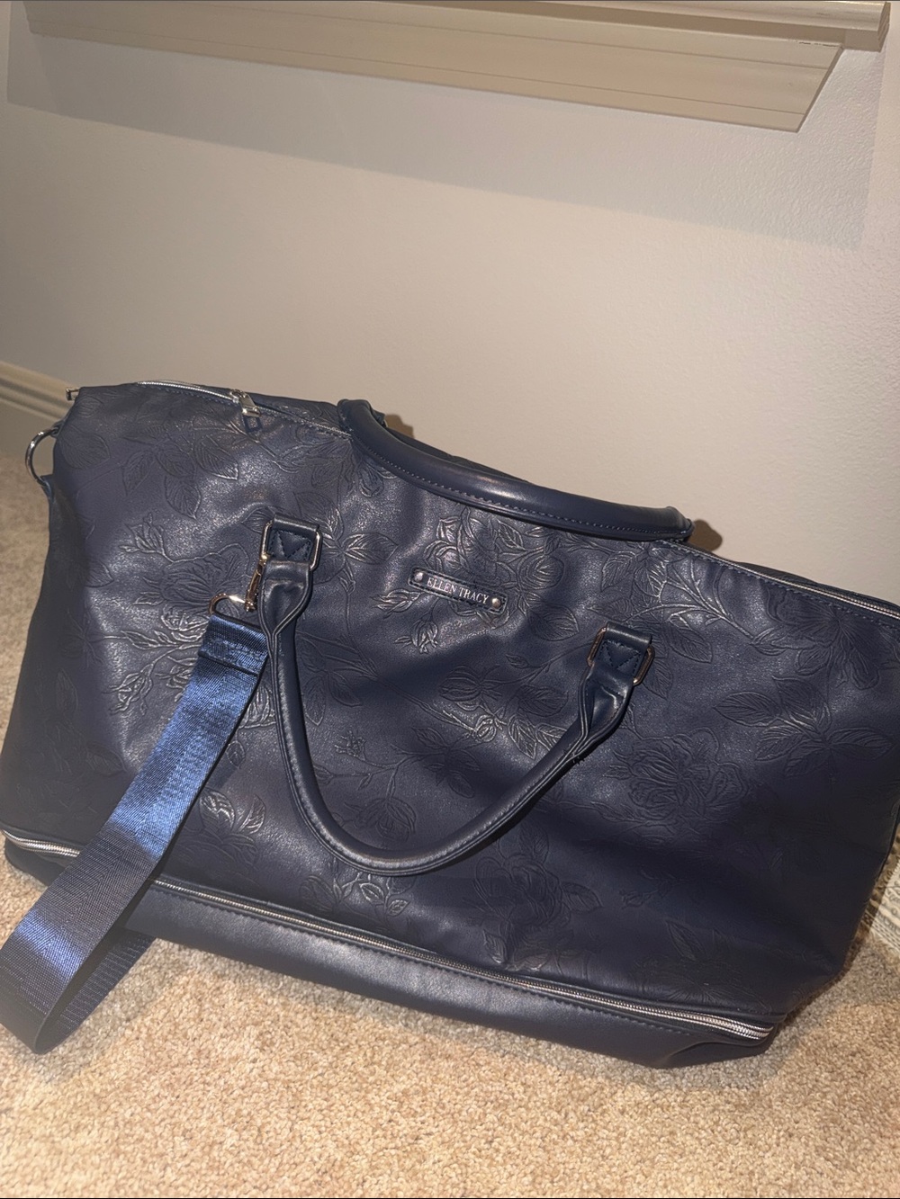 Ellen Tracy Navy Floral-Embossed overnight bag.